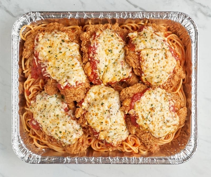 Family Chicken Parmigiana Over Spaghetti.