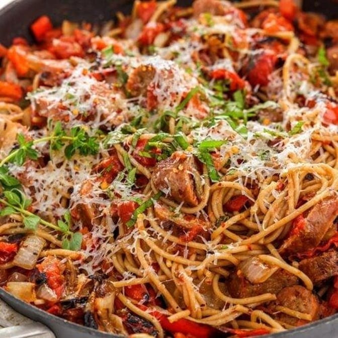 Family Sausage & Pepper Over Spaghetti.